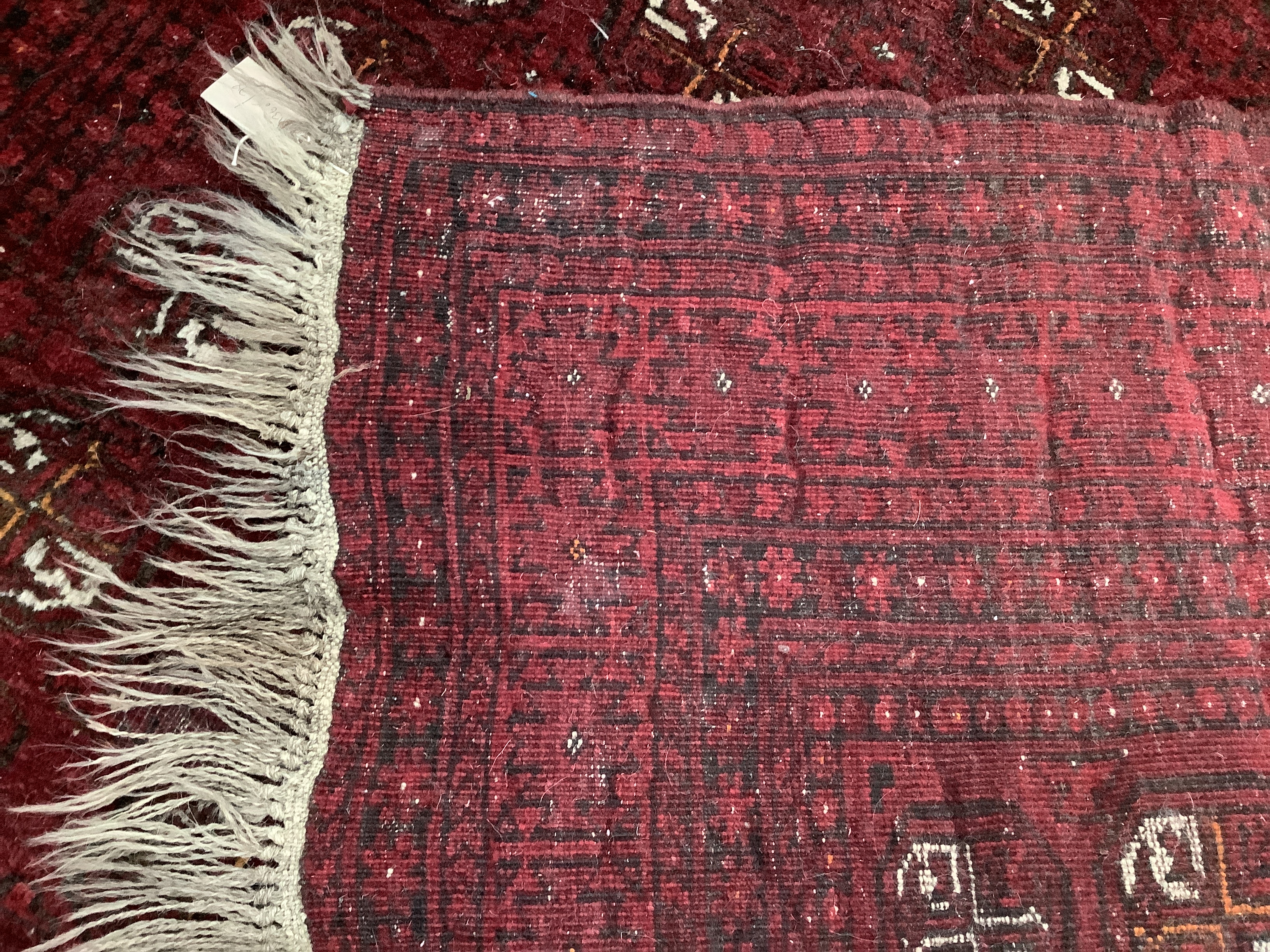 A Bokhara red ground carpet, 240 x 156cm